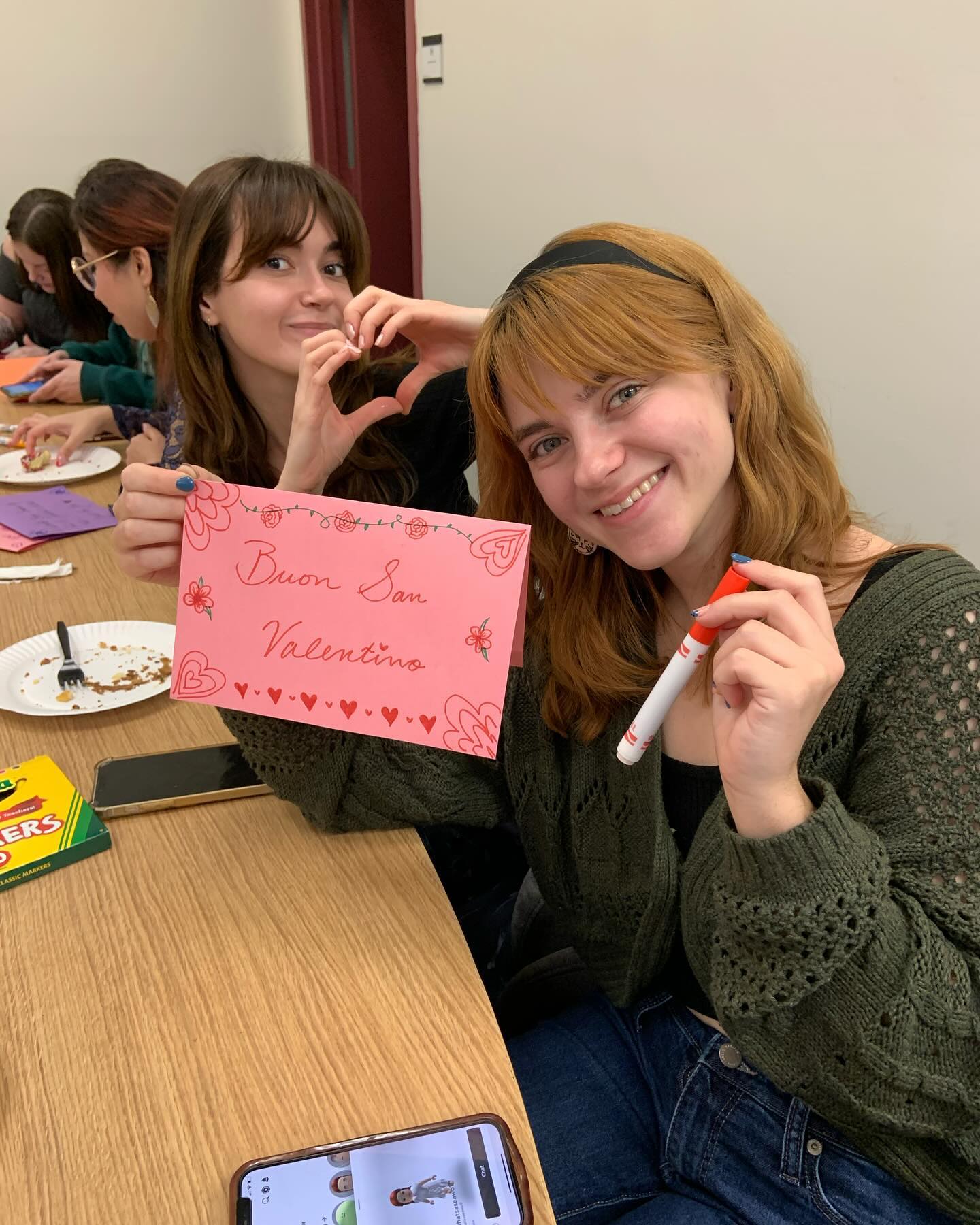 CIAO San Valentino evening photo of the CIAO San Valentino evening at the Center. There are 2 members writing cards.