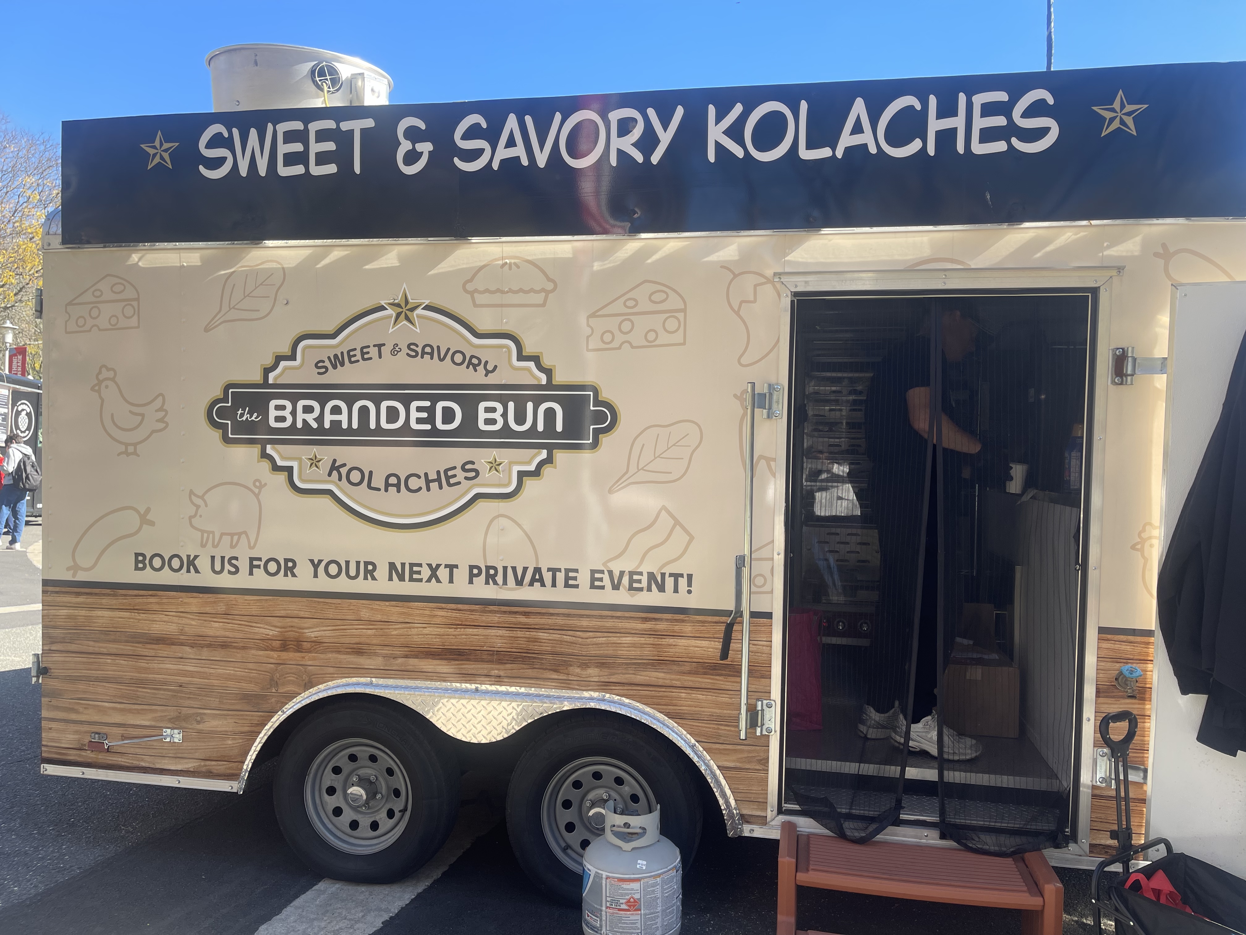 Picture of a side of the Branded Bun truck featuring its logo.